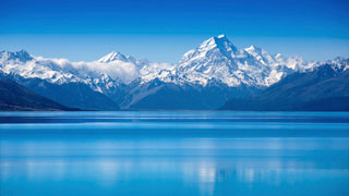 Photo of For honeymooners who want to experience Eden, New Zealand is a rare bastion of pure, untouched nature. Steaming volcanoes, giant kauri trees, and crystalline glaciers are just some of the amazing natural beauty of this country. For adventure, take a hot-air balloon ride or go alpine skiing, deep-sea diving or white-water rafting.